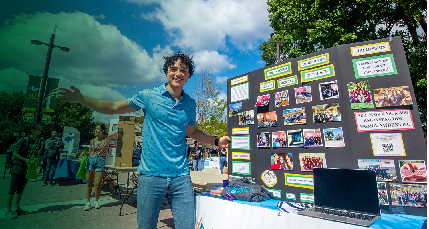 A Ƶ student shares information about their volunteer organization on the Fairfax Campus.