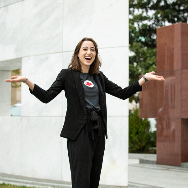 Ƶ student Jennifer Lyon poses joyfully in front of the headquarters of the American Red Cross, where she was able to complete an internship